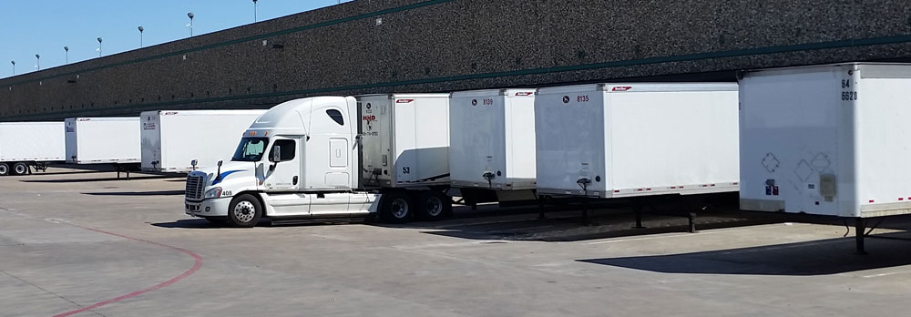 Image of rows of semi trucks