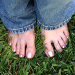 Image of bare feet in clean grass