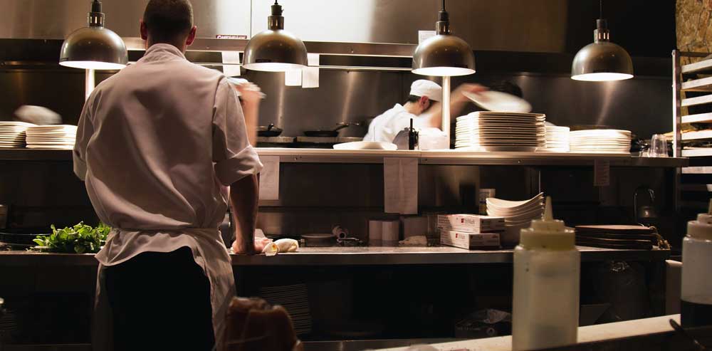 Sgt. Poopers can eliminate restaurant odors by kiling the germs that cause them. Image of restaurant kitchen