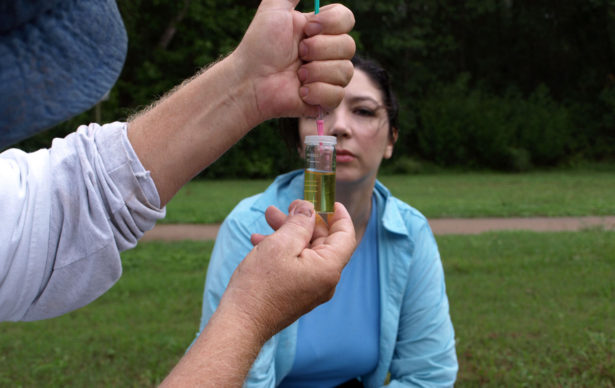 Erica Hall, owner Sgt. Poopers, views monthly water testing procedure