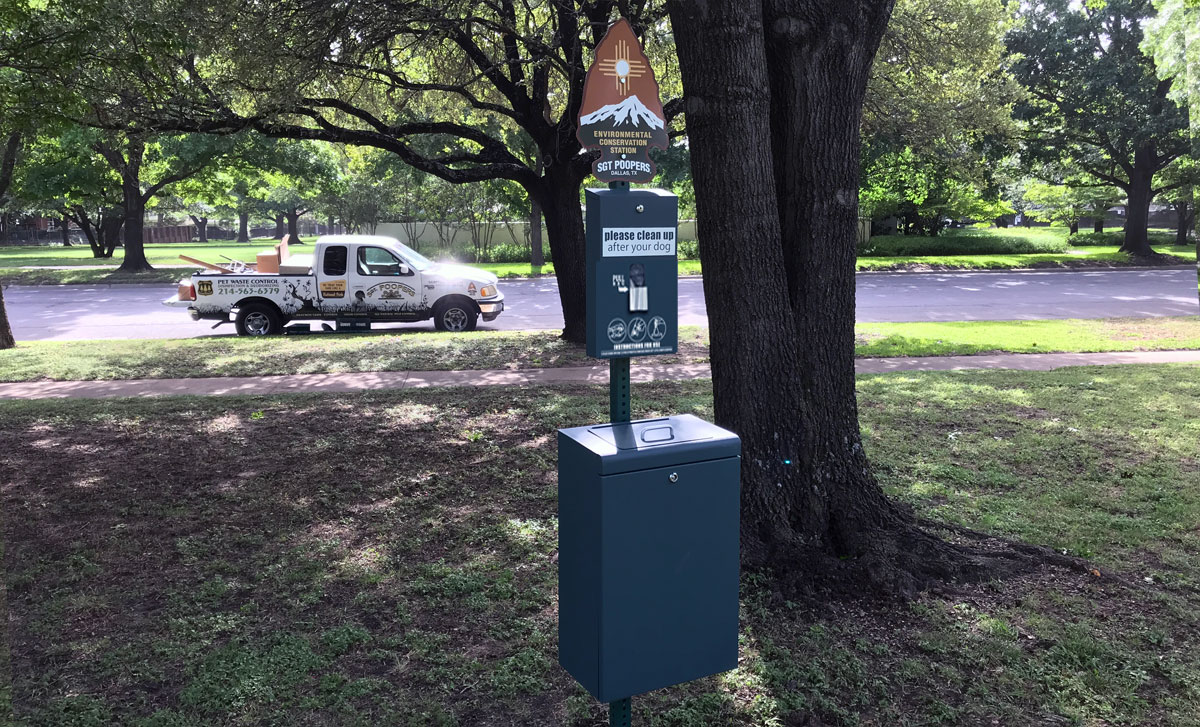 Dog Waste Station with strap bag dispenser.
